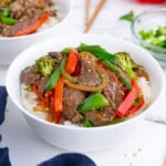 Two bowls with beef stir fry is an easy weeknight dinner.