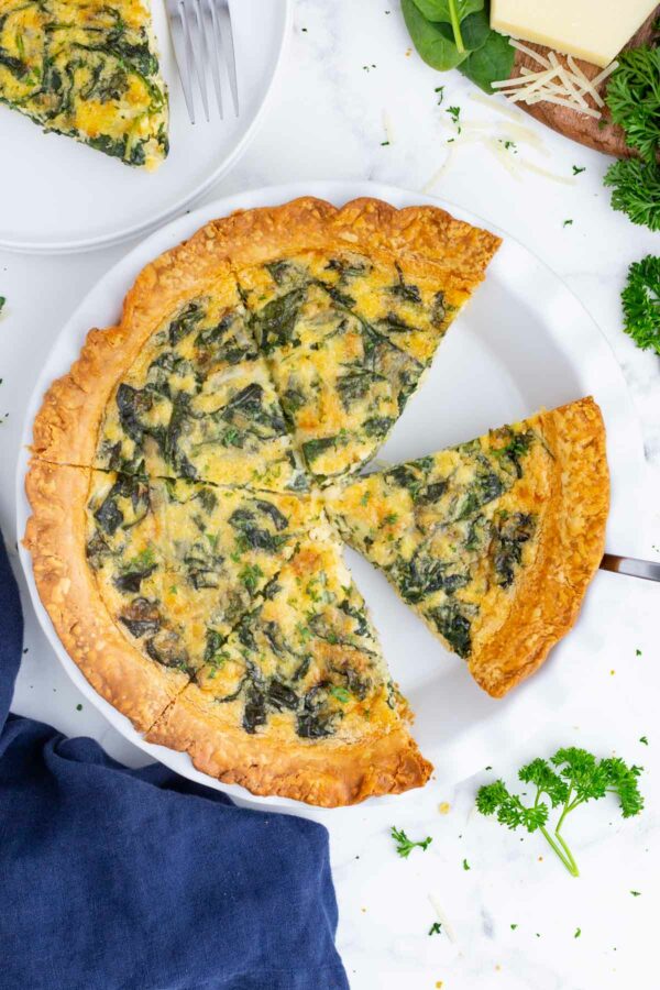 A Quiche Florentine is sliced before serving.