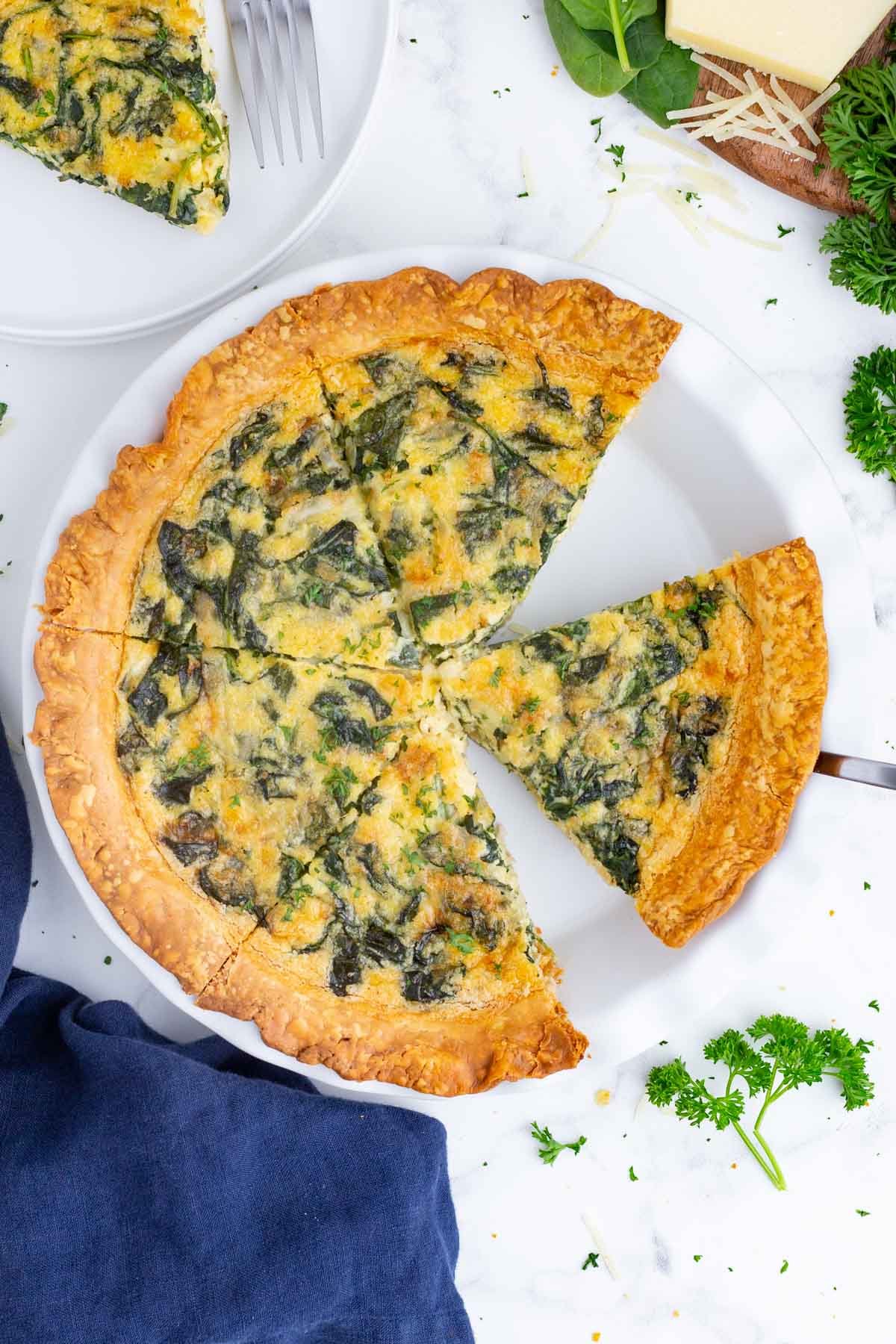 A Quiche Florentine is sliced before serving.