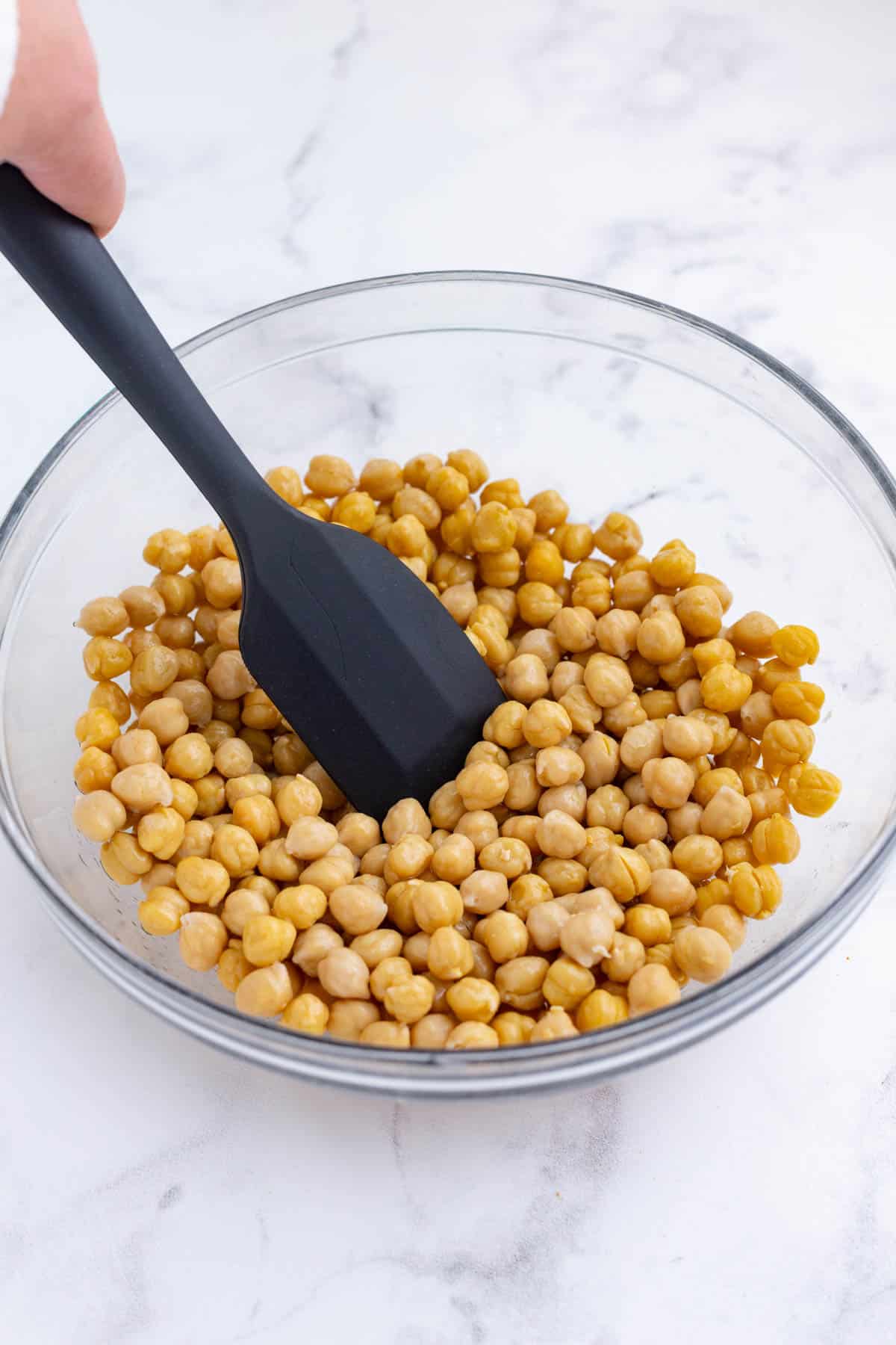 Toss to cover the chickpeas in oil.