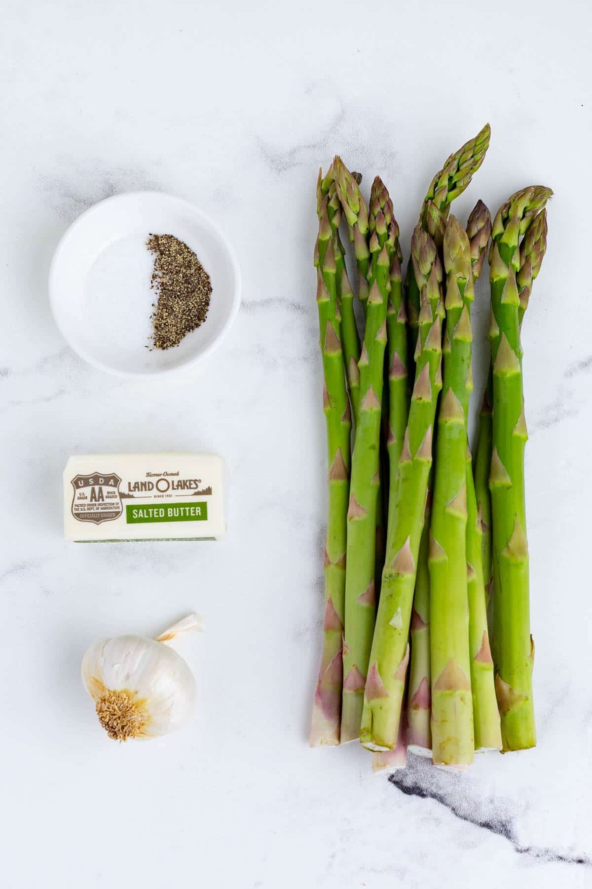 Asparagus, butter, and seasonings are the ingredients for this dish.
