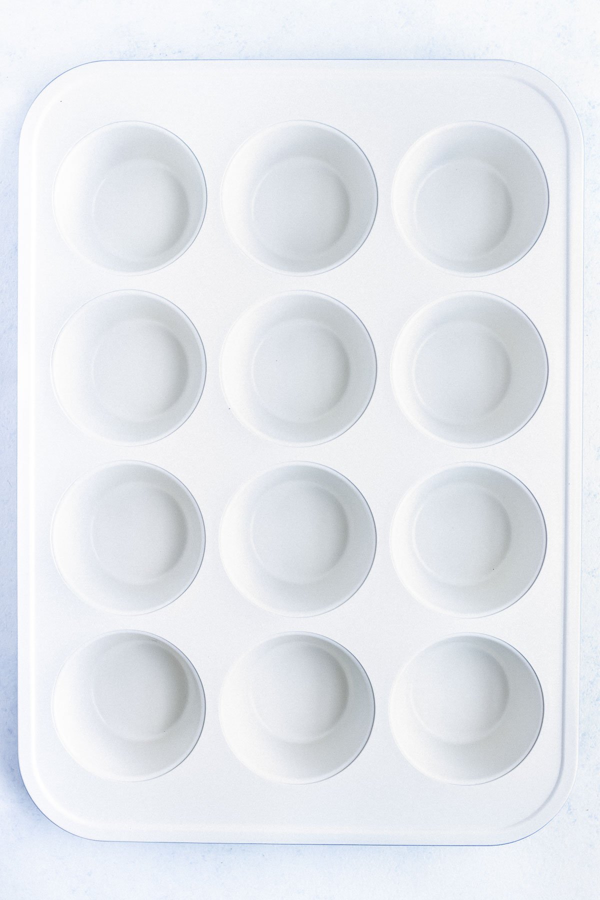 A ceramic non-stick muffin tray.