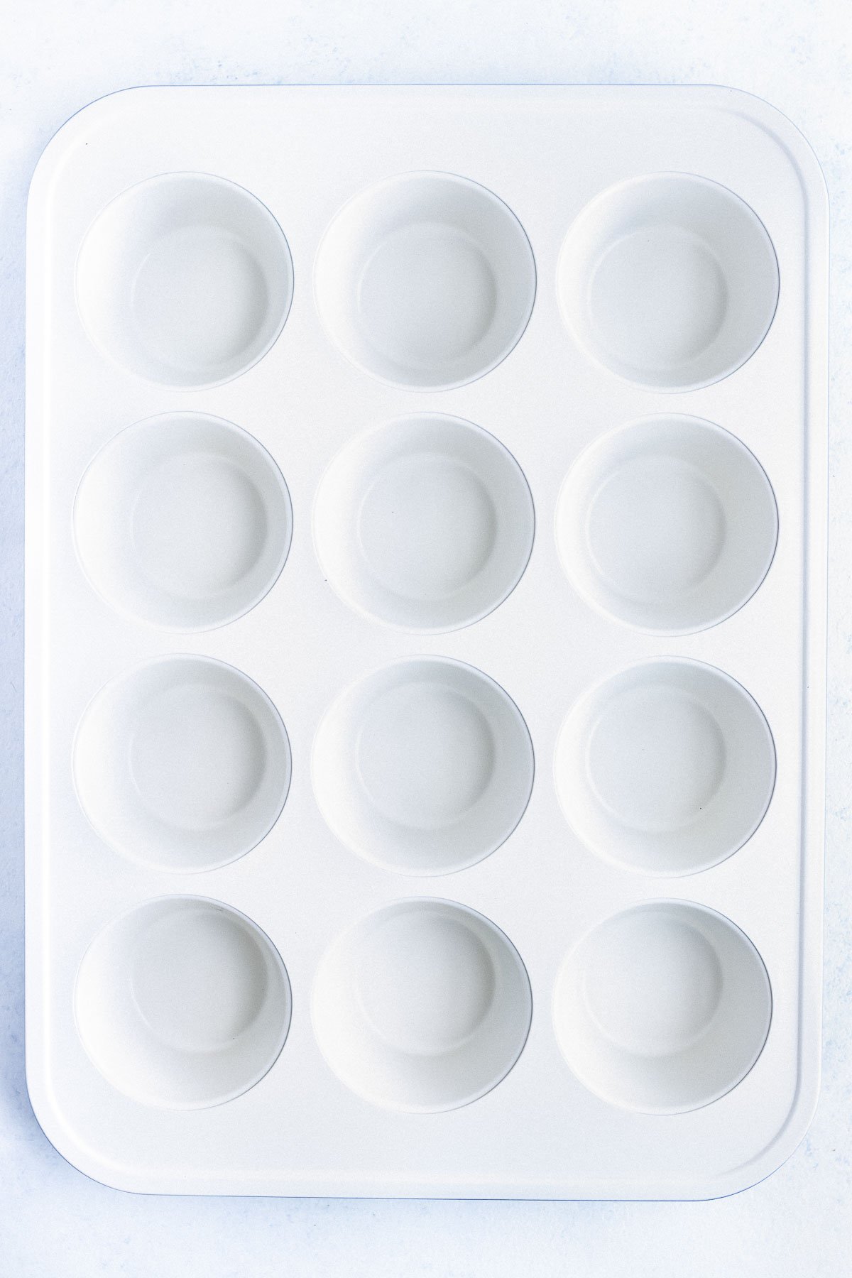 A ceramic coated muffin pan is shown  as the best option for an egg muffins recipe.