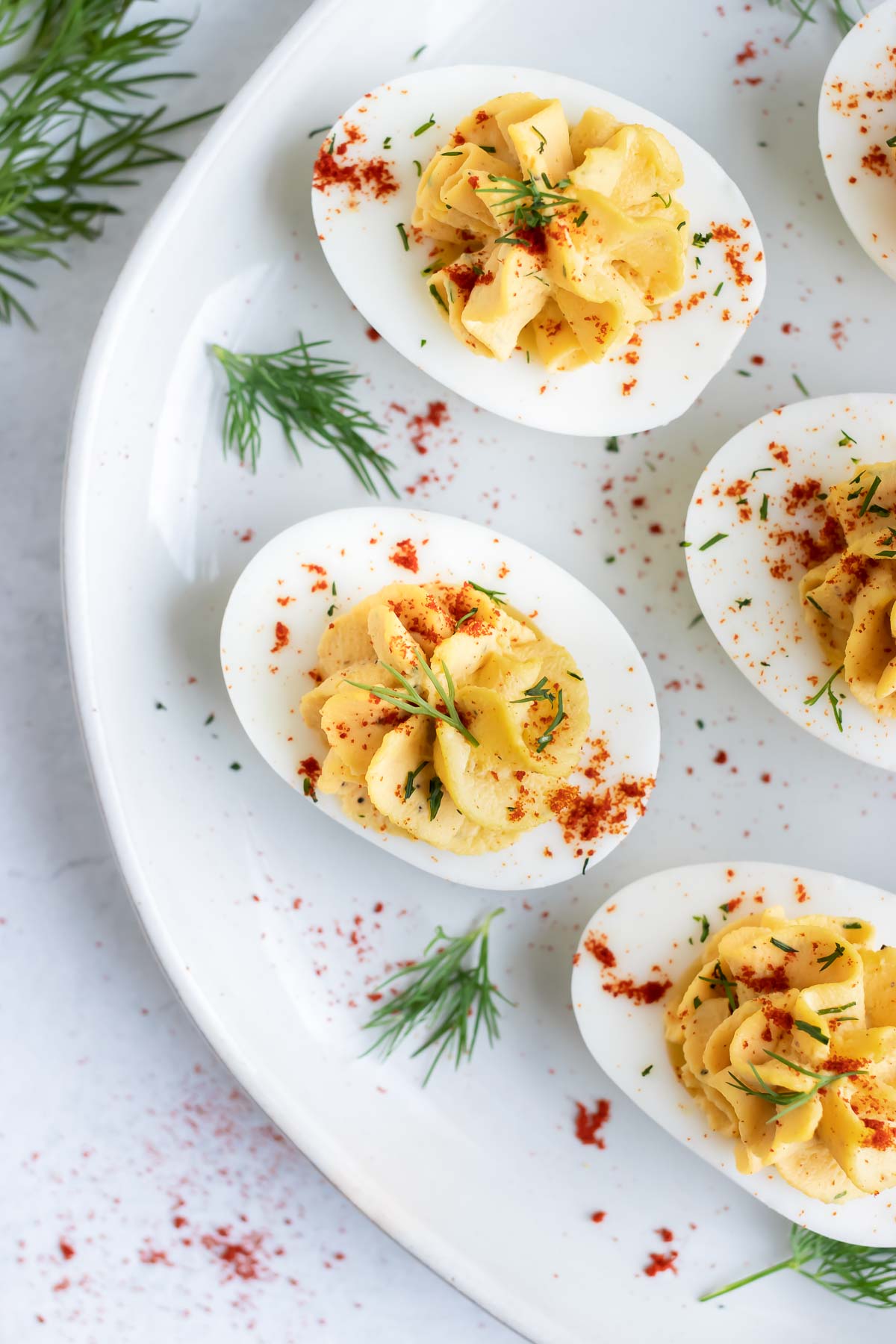 The best, easy, and traditional Southern deviled eggs recipe with fresh dill and Paleo mayonnaise.