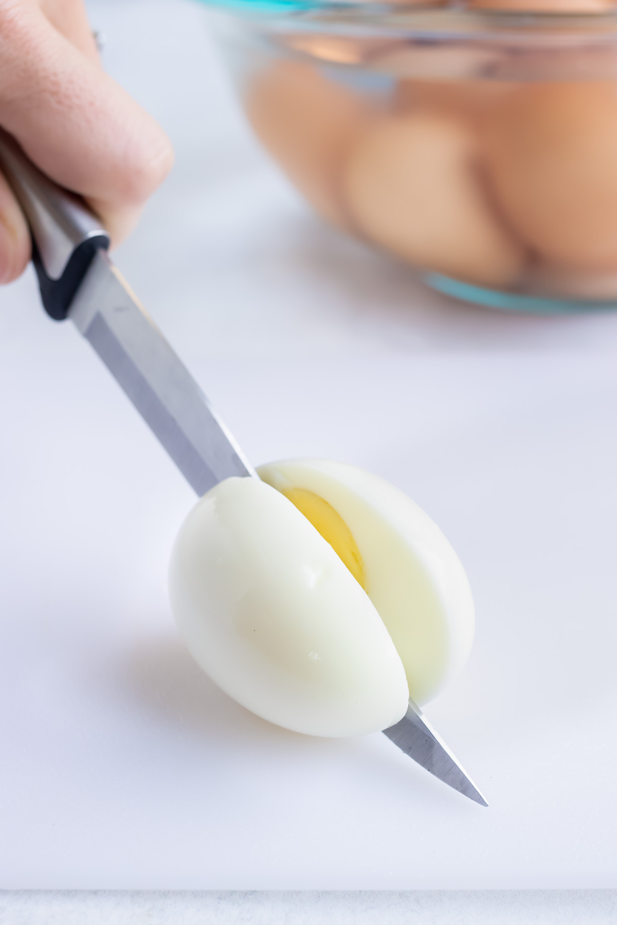 A hard-boiled egg is cut in half.