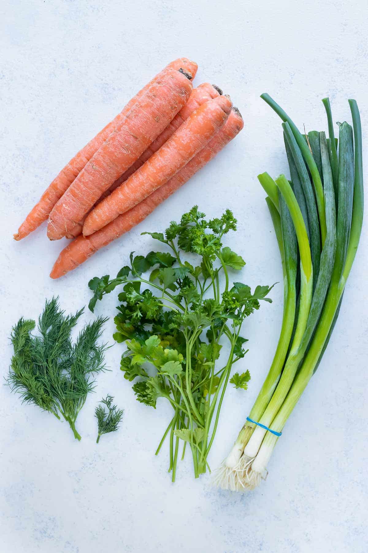 Carrots, green onions, dill, and parsley are ingredients that can be used in this recipe.