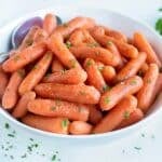 A bowl of pressure cooker glazed carrots are served for an Easter side.