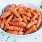 A bowl of pressure cooker glazed carrots are served for an Easter side.