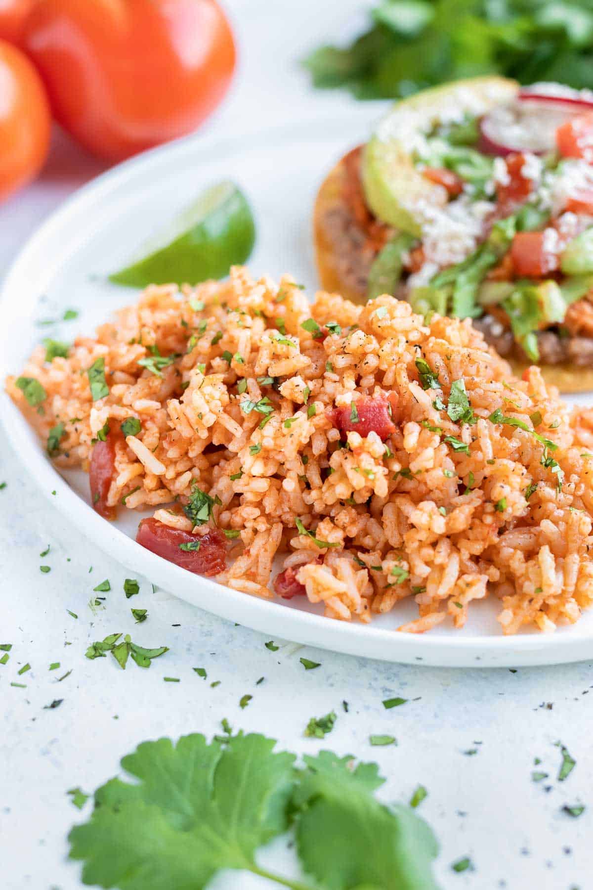Easy Mexican rice is served as a side dish on a plate.