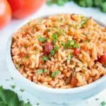 Instant Pot Mexican Rice is served in a big white bowl for dinner.