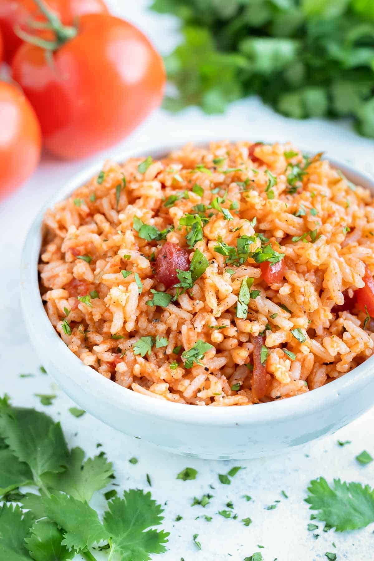 Instant Pot Mexican Rice is served in a big white bowl for dinner.