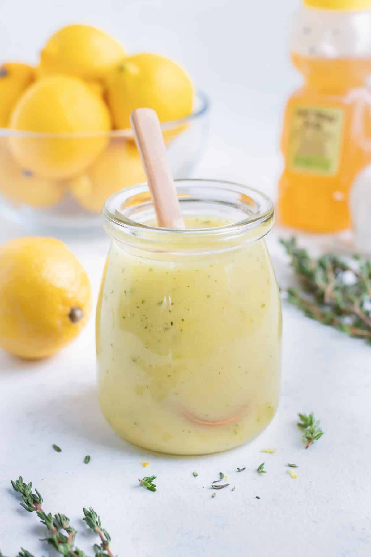 Lemon vinaigrette is served in a glass jar.