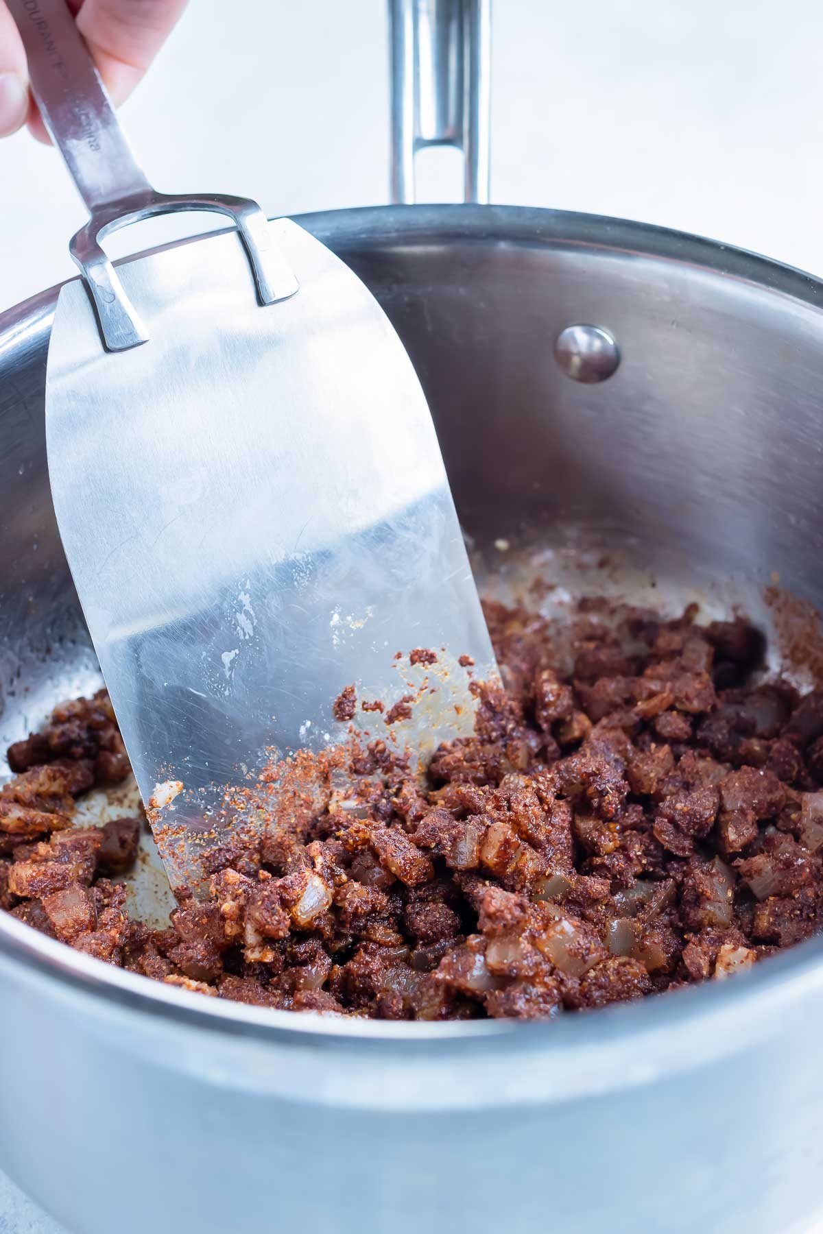 The seasonings and spices are added to the pan.