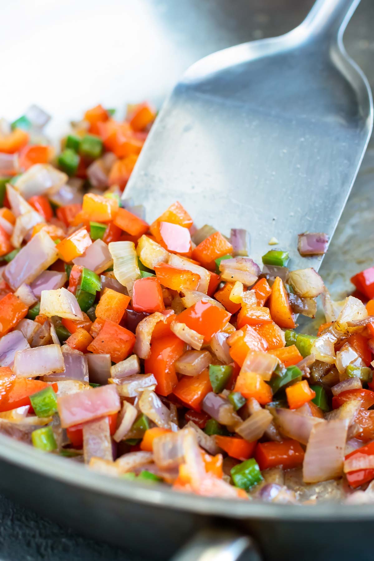 Veggies are cooked in a skillet.