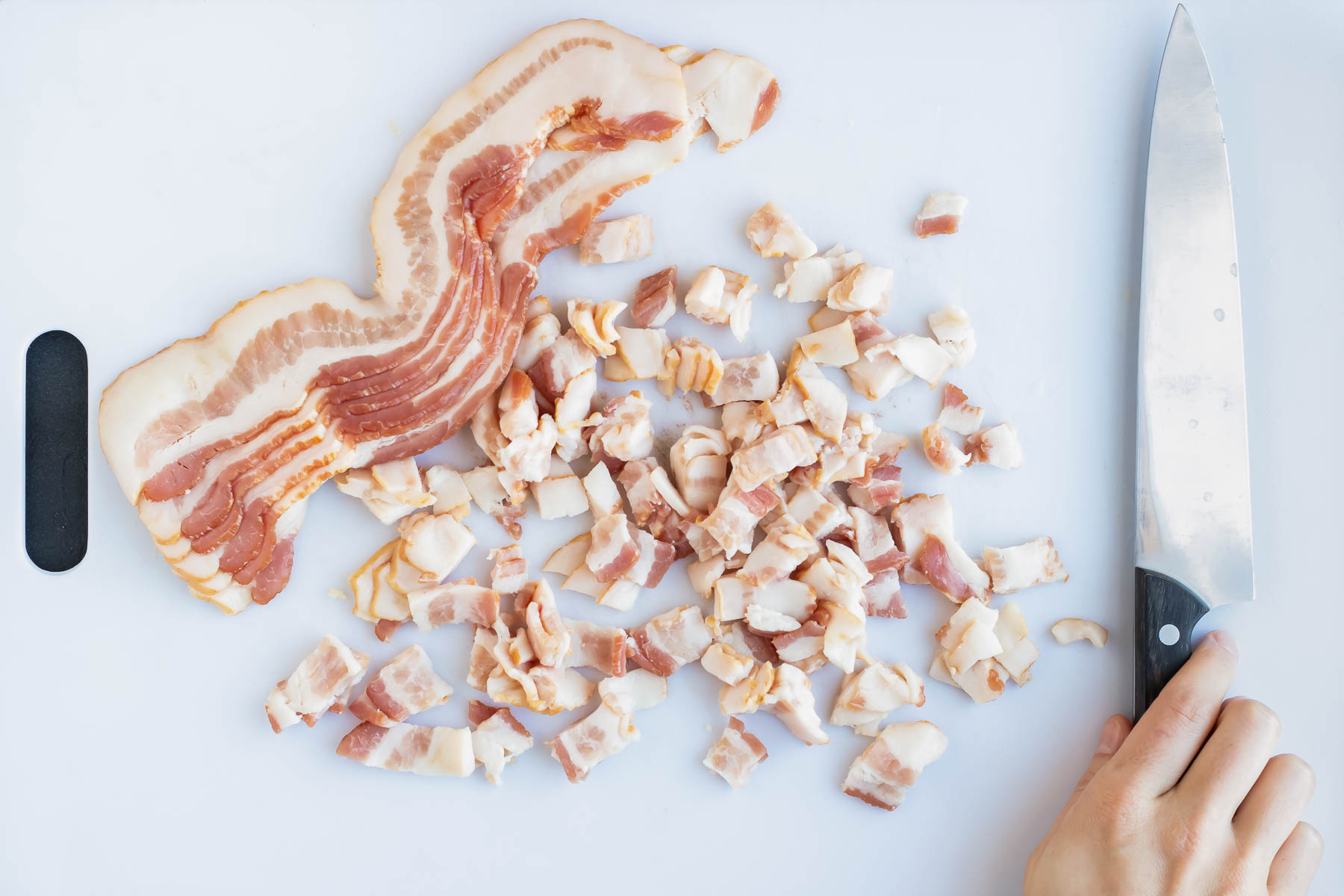 Bacon is sliced into small pieces.