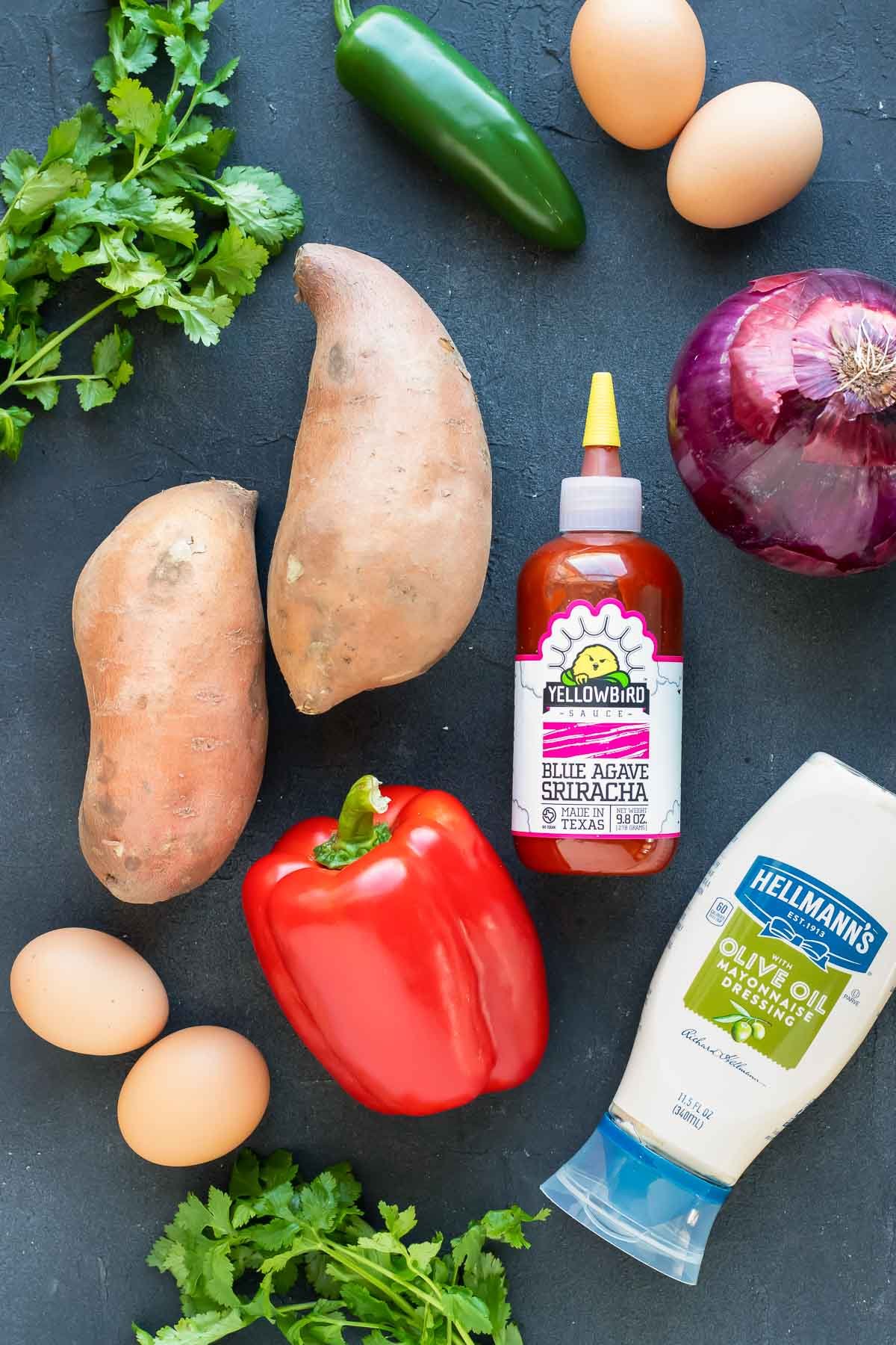 The ingredients for a sweet potato hash recipe with eggs.