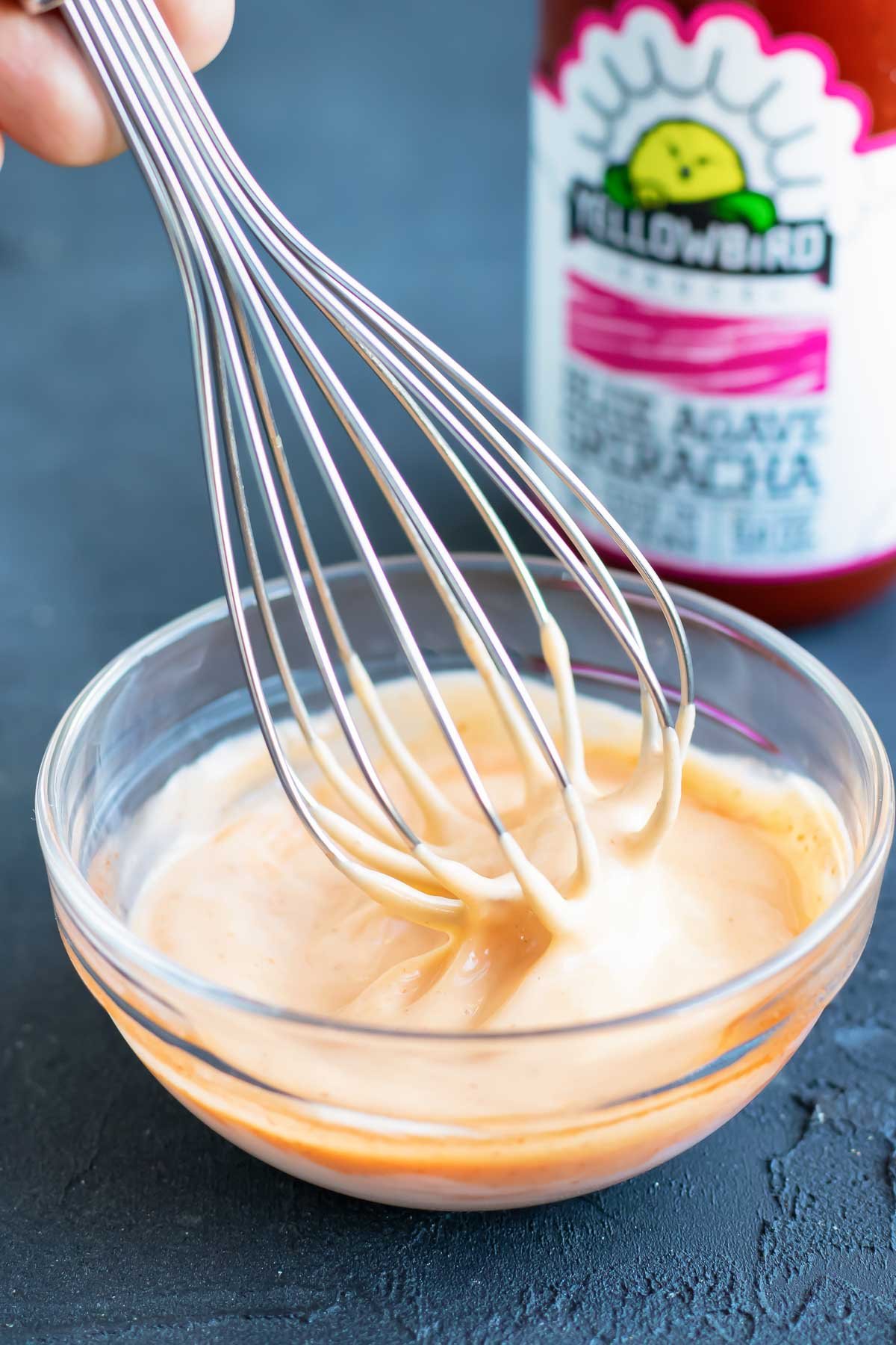 Sriracha mayo sauce is made in a bowl.