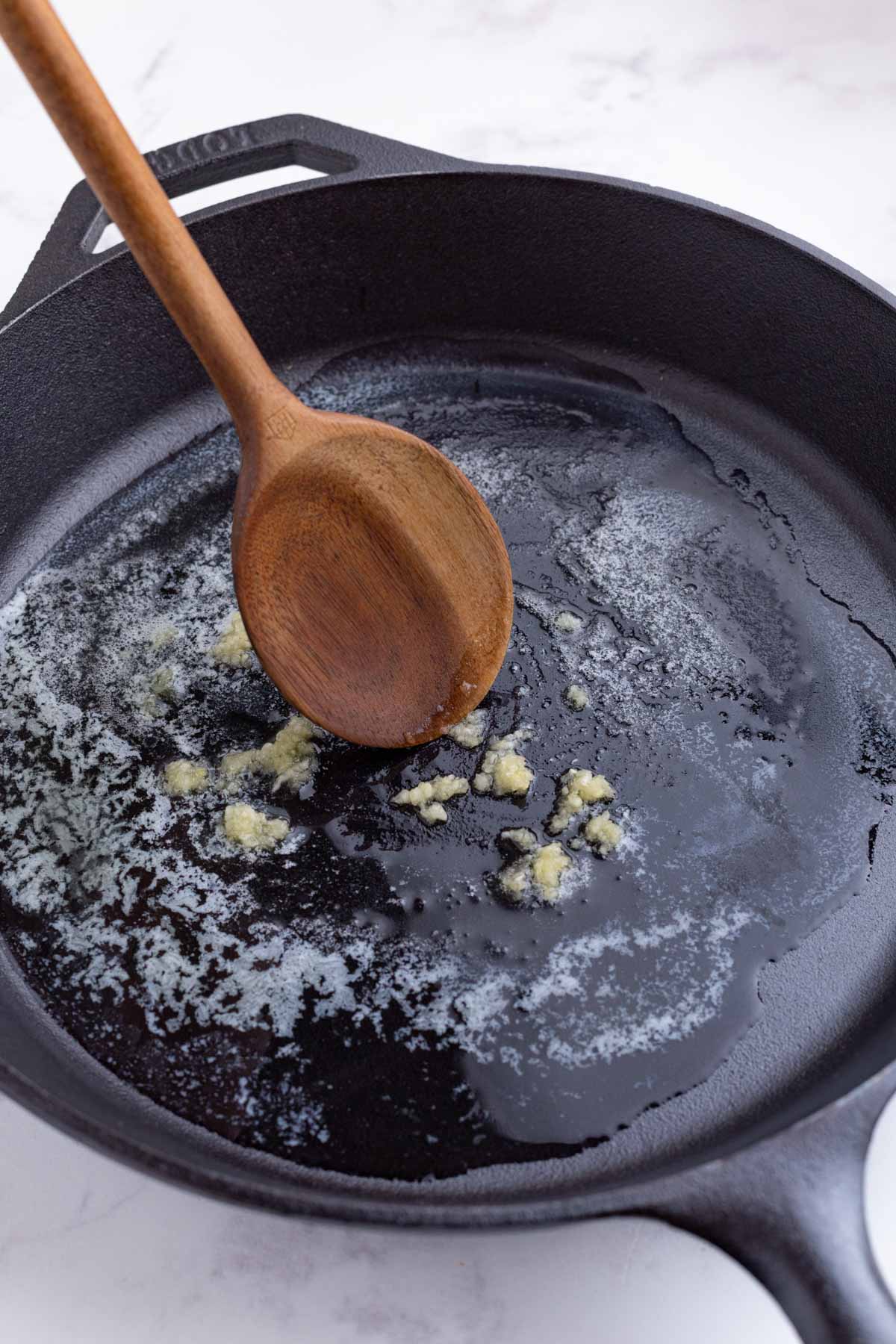 Garlic is sauteed with the butter.
