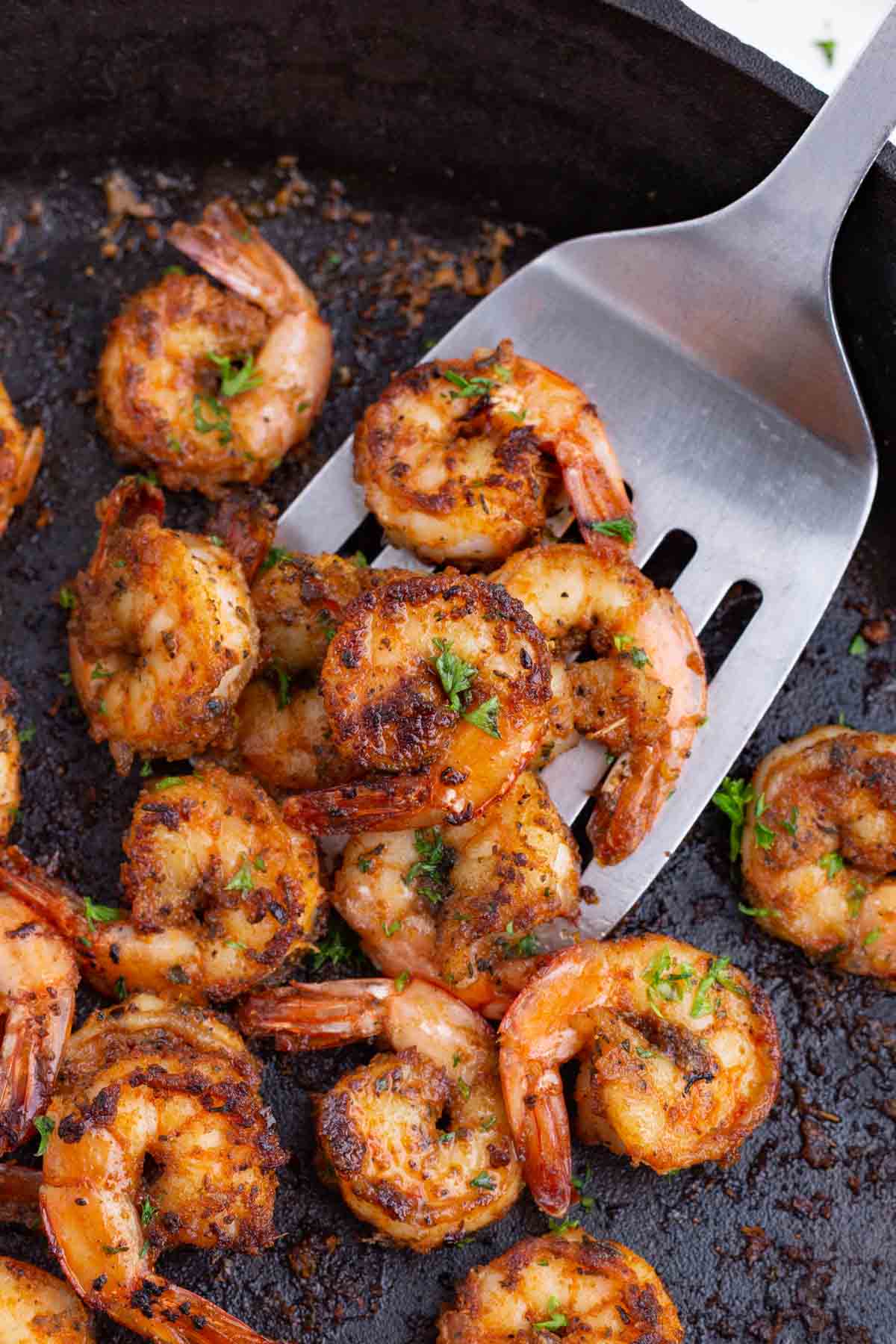 Perfectly cooked shrimp is seasoned with Cajun spices.