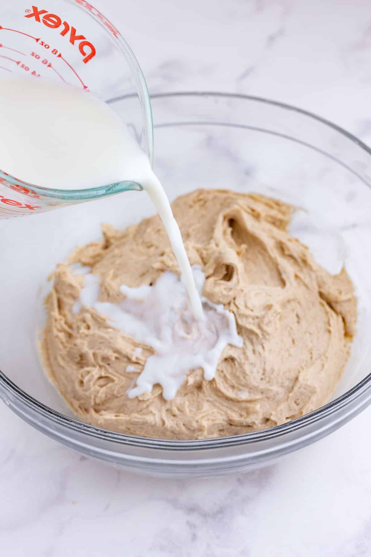 Milk is added to the cake batter.