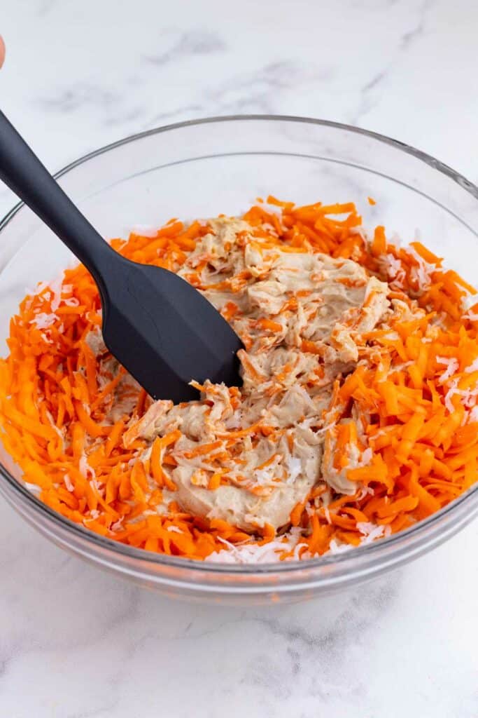 Shredded carrots and coconut are added to the cake batter.