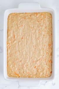 The batter is spread across a baking dish.