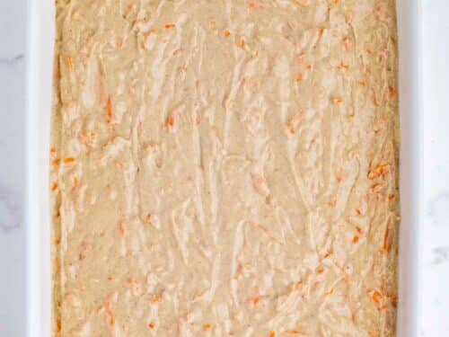 The batter is spread across a baking dish.