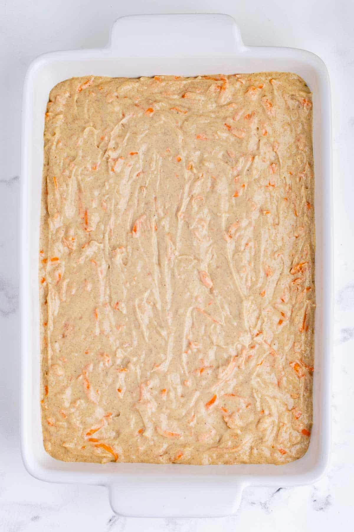 The batter is spread across a baking dish.