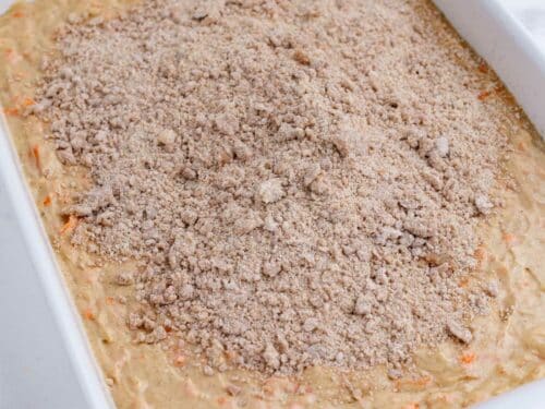 The crumb topping is spread across the batter.