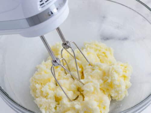 A mixer beats the butter and sugar.