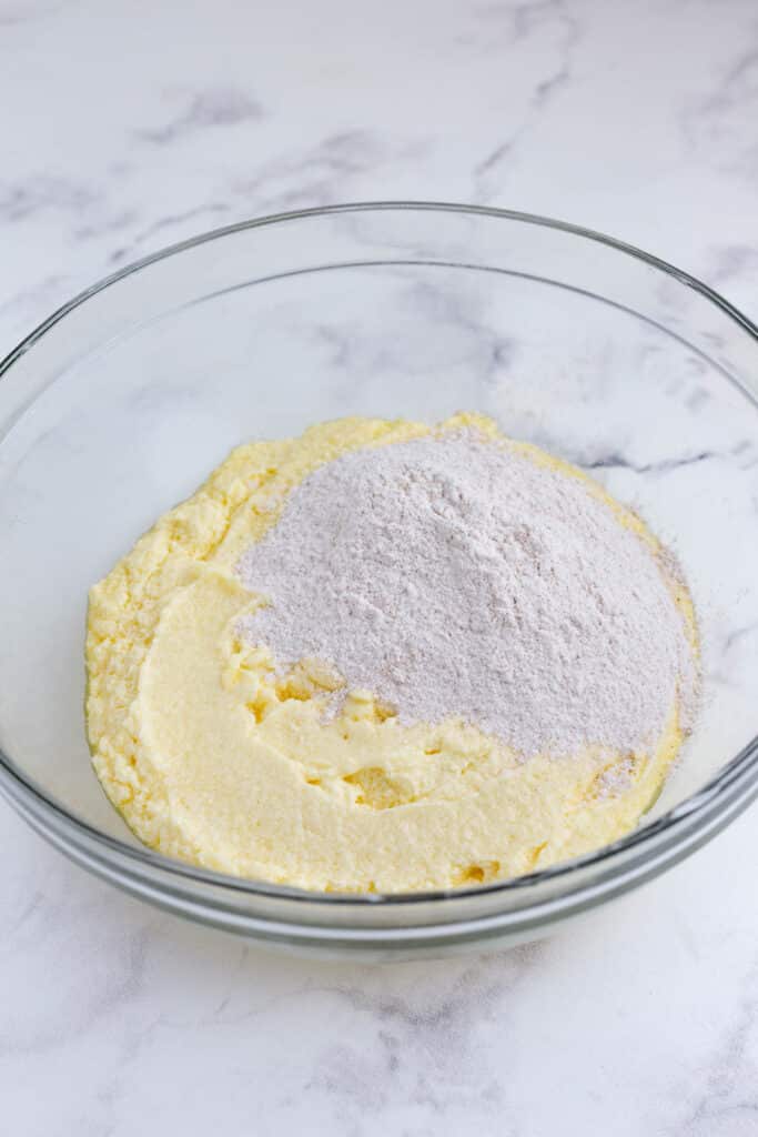 The flour mixture is added in increments to the wet ingredients.