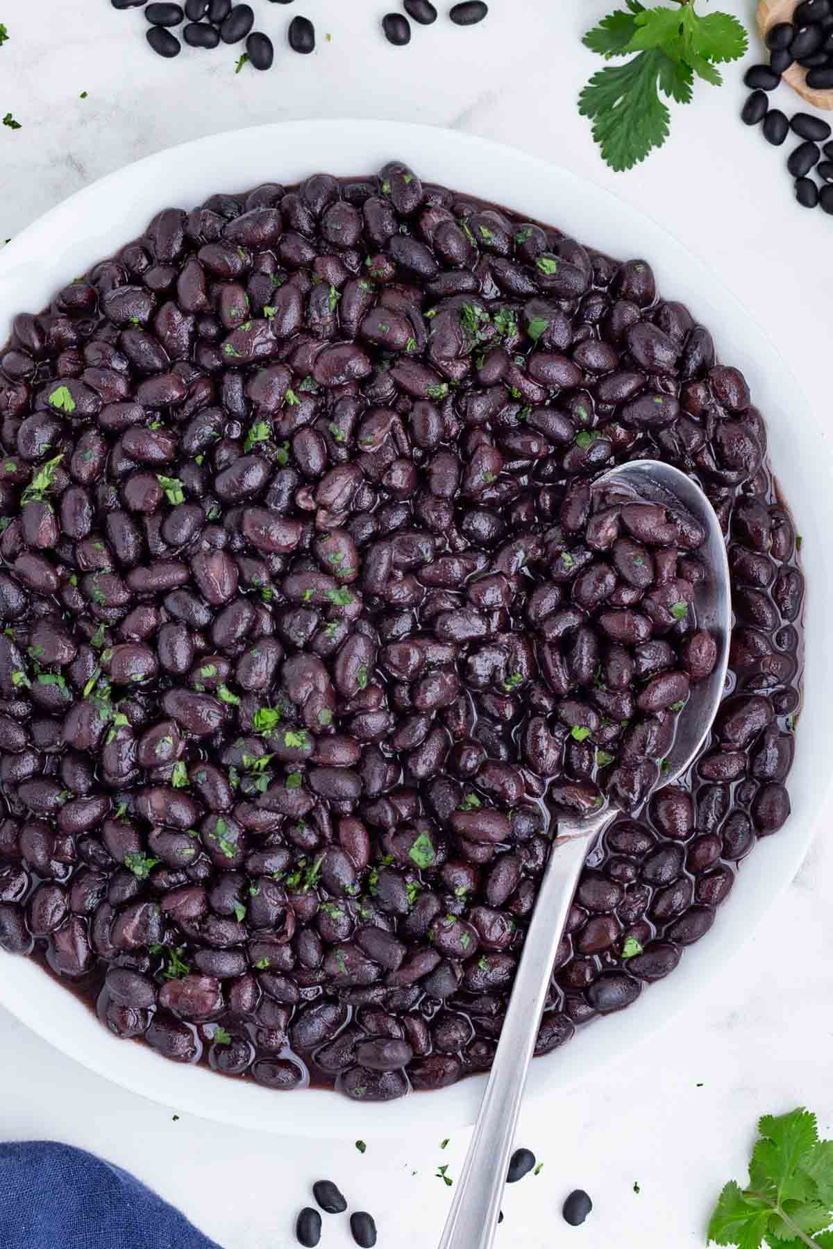 Instant Pot black beans are delicious in tacos and burrito bowls.