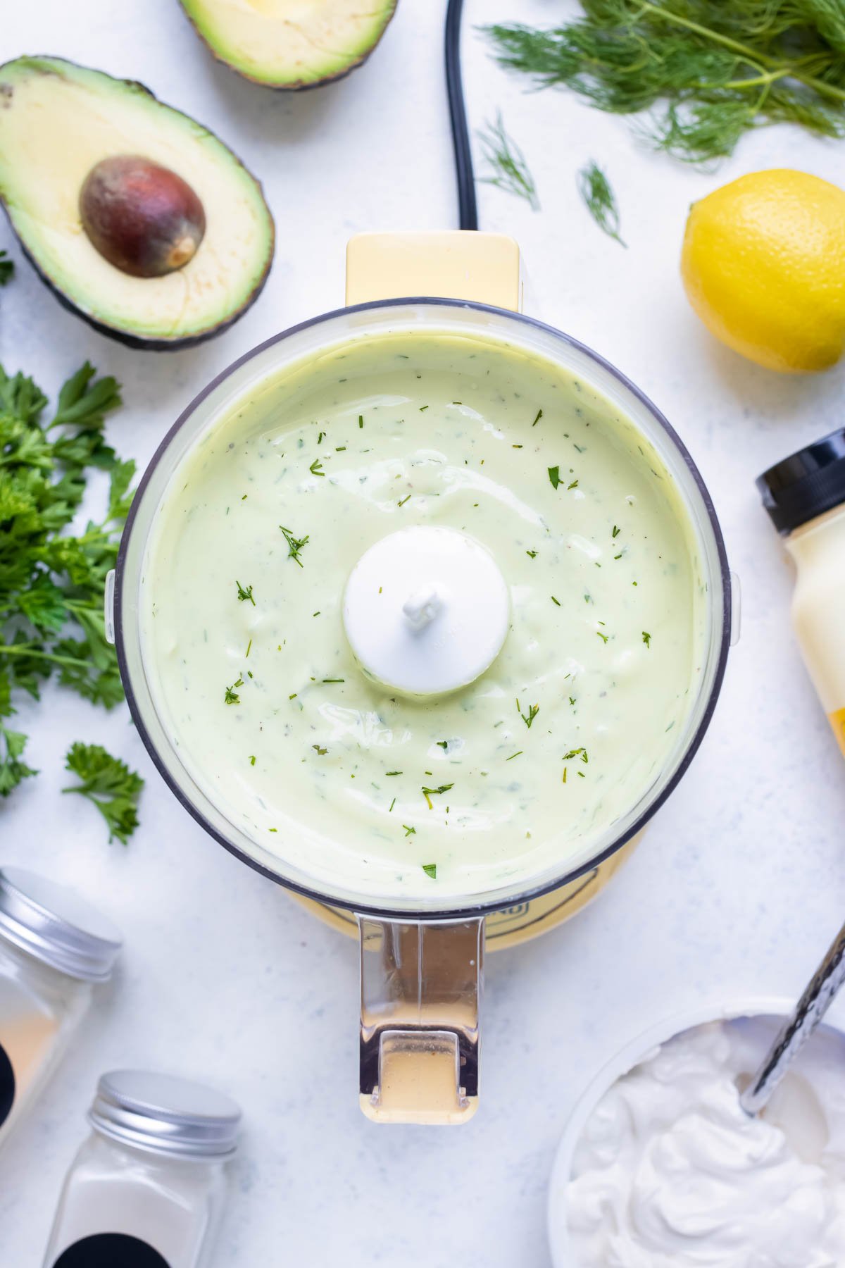 Creamy Avocado Ranch Dressing is made in a mini food processor.