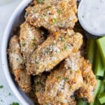 Crispy Parmesan Garlic Chicken Wings were baked in the oven and served with celery and ranch dressing.
