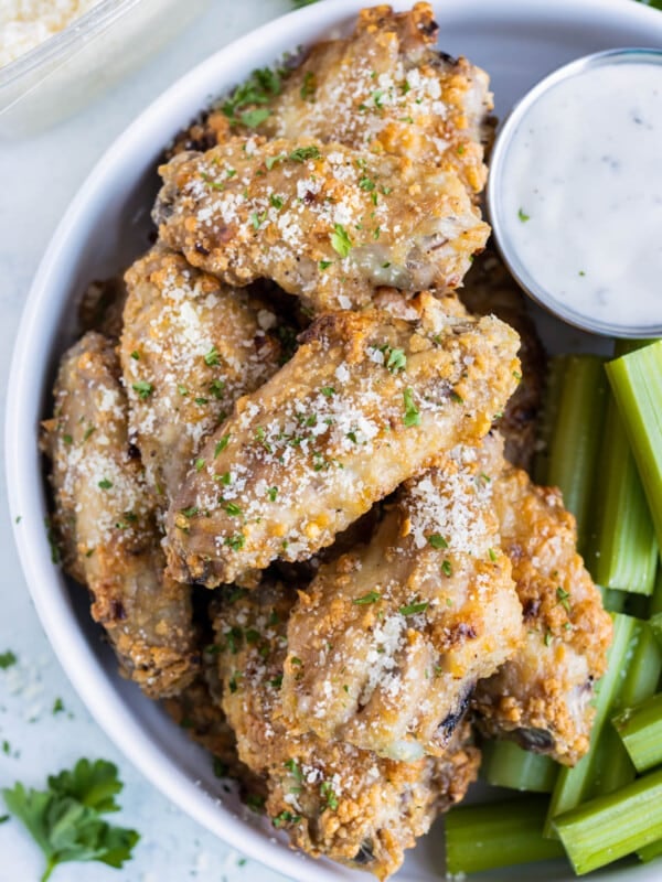 Crispy Parmesan Garlic Chicken Wings were baked in the oven and served with celery and ranch dressing.