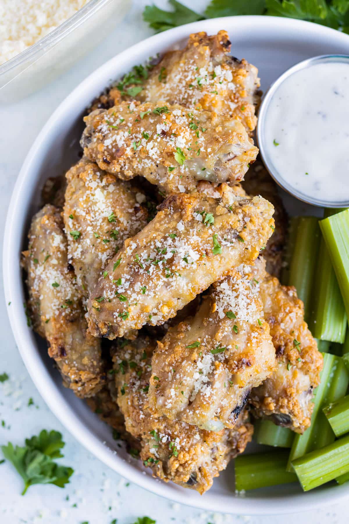 Crispy Parmesan Garlic Chicken Wings were baked in the oven and served with celery and ranch dressing.