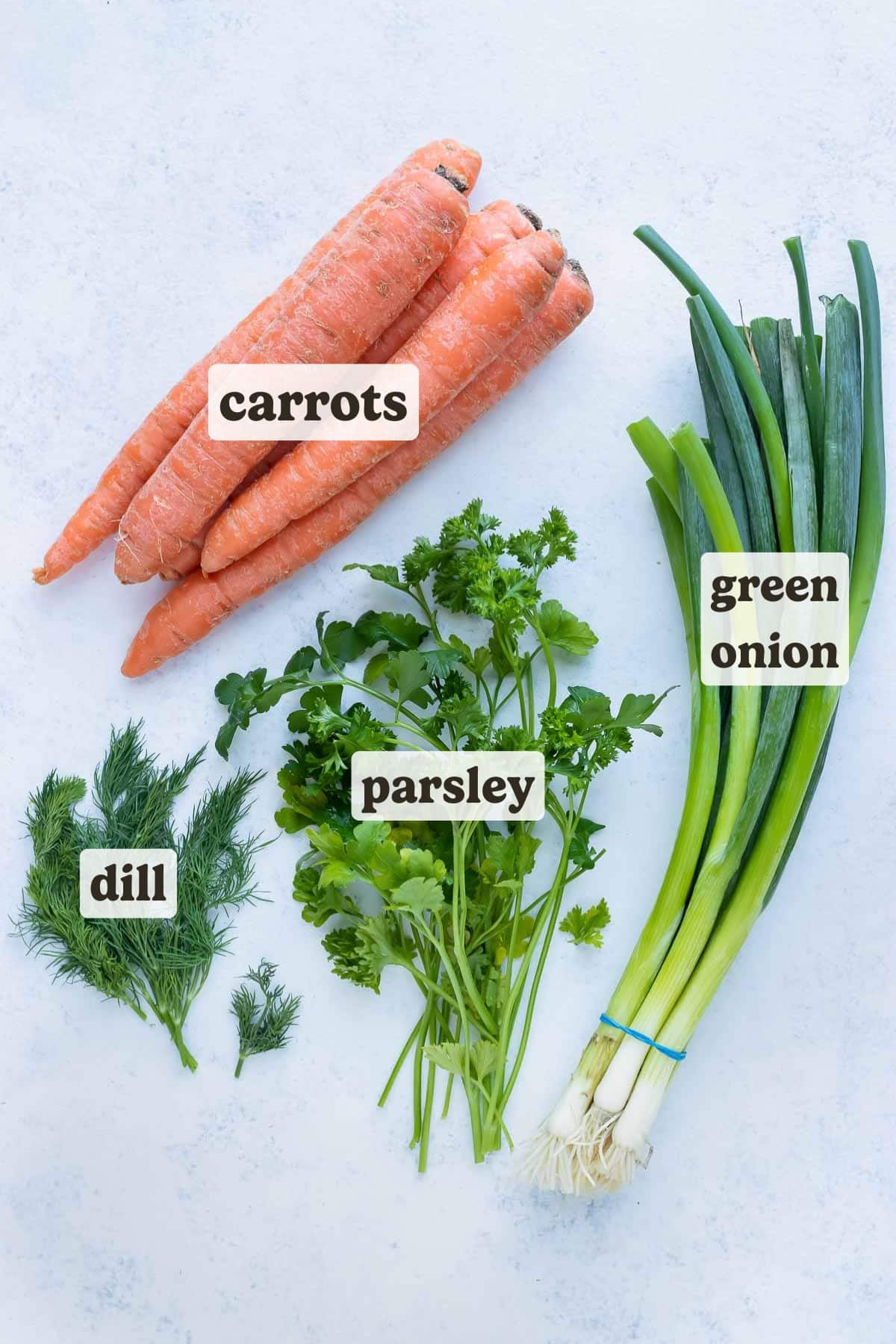 Carrots, green onions, dill, and parsley are ingredients that can be used in this boiled carrots recipe.