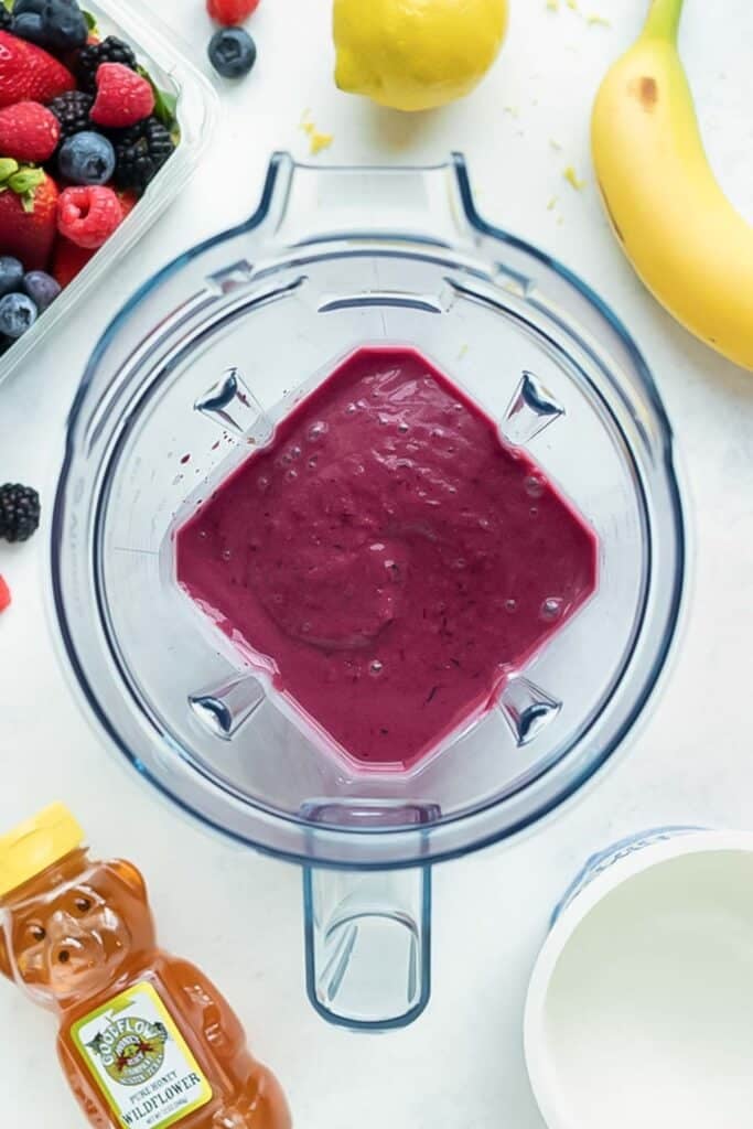 Berries and other ingredients are mixed until a thick, creamy, and smooth consistency is reached.