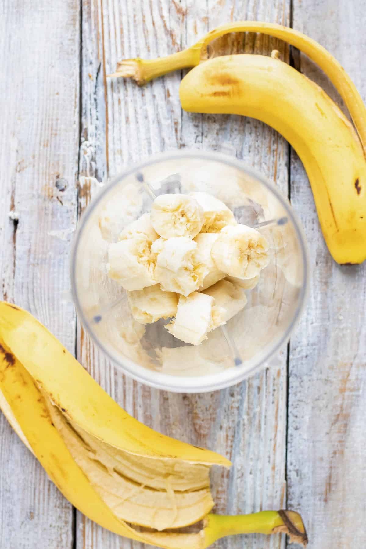 Bananas are added to a blender.