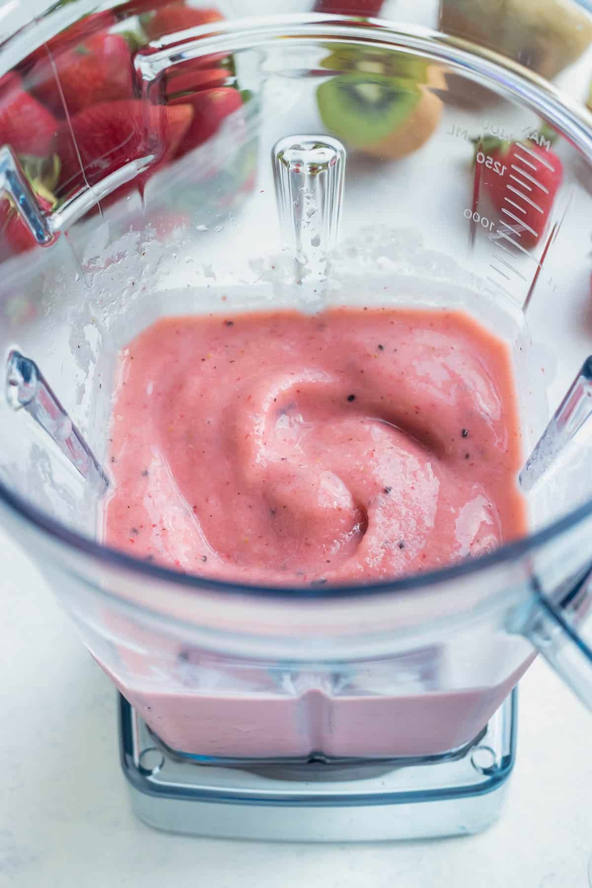 Strawberry and kiwi smoothie is made in a high speed blender for the best texture.