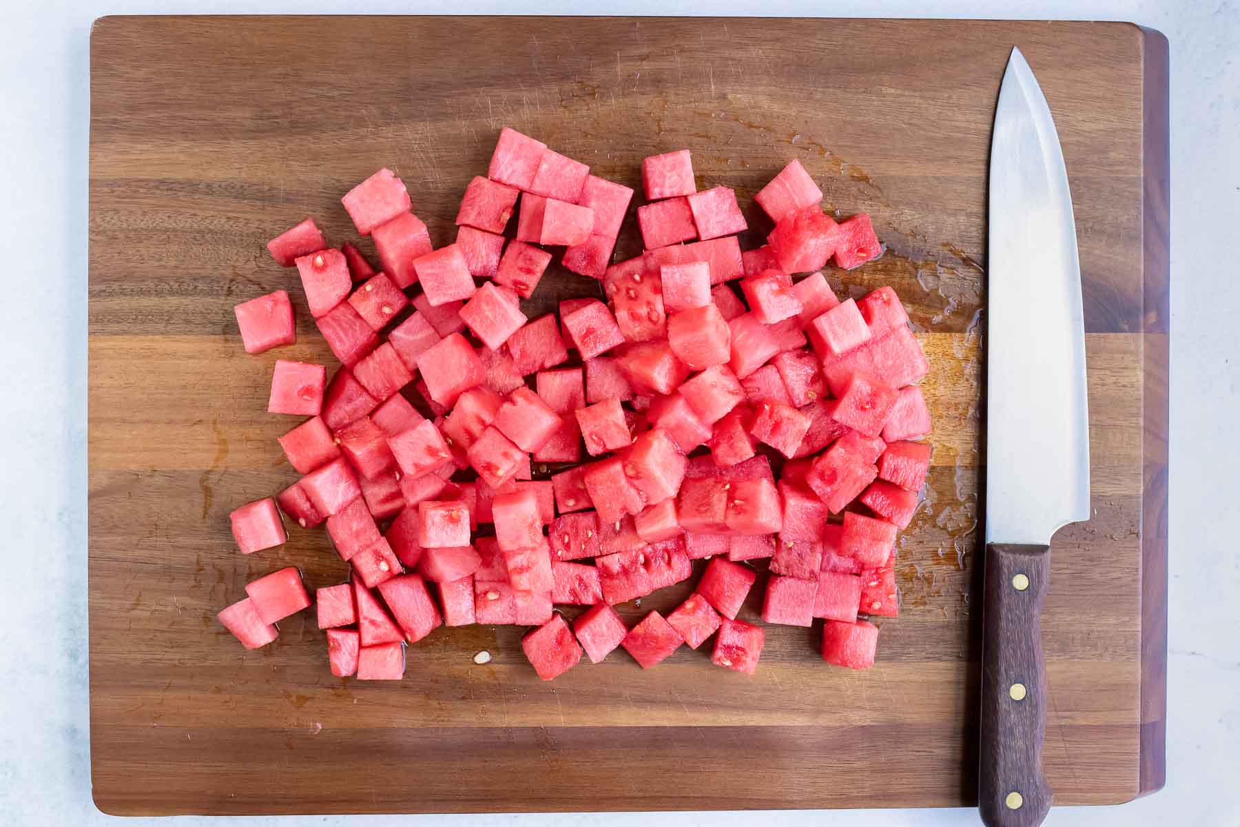 Cubed watermelon is prepped for this recipe.