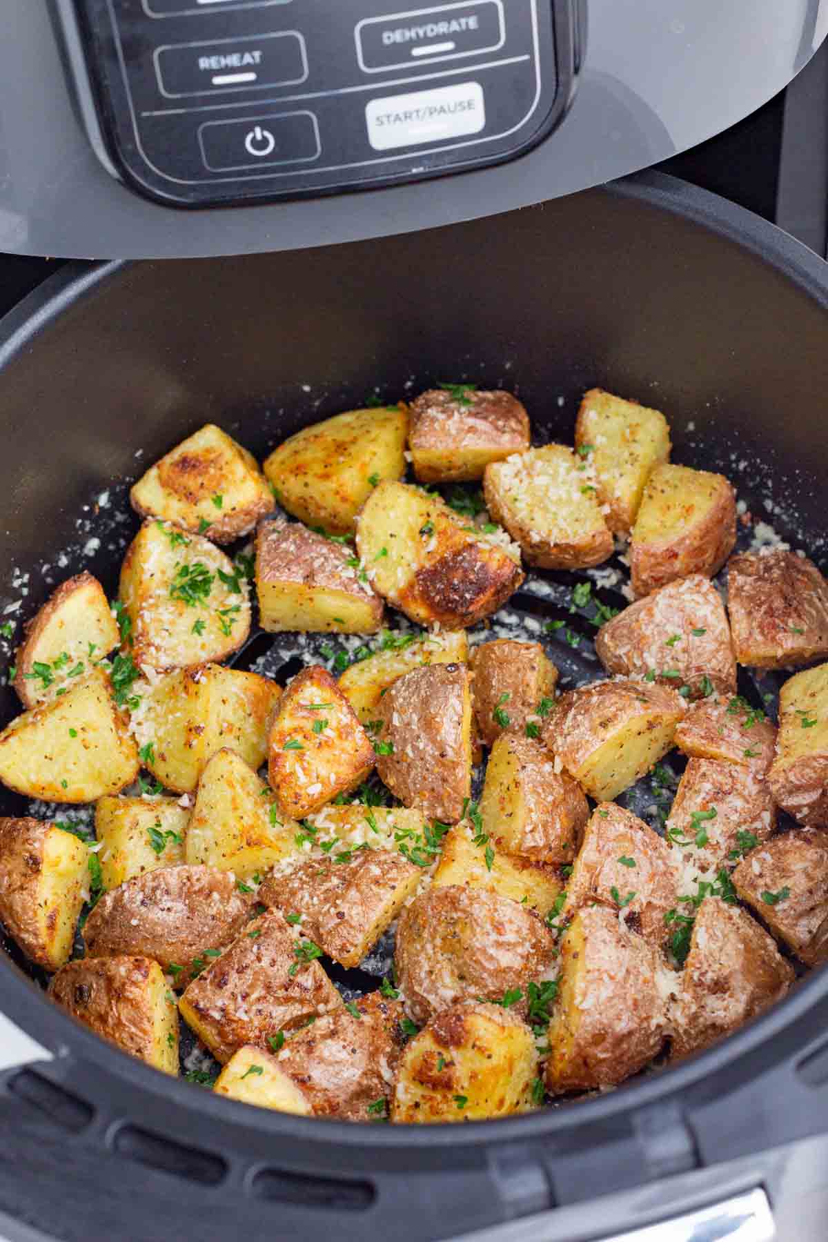 Roasted potatoes are cooked in the air fryer to save time.