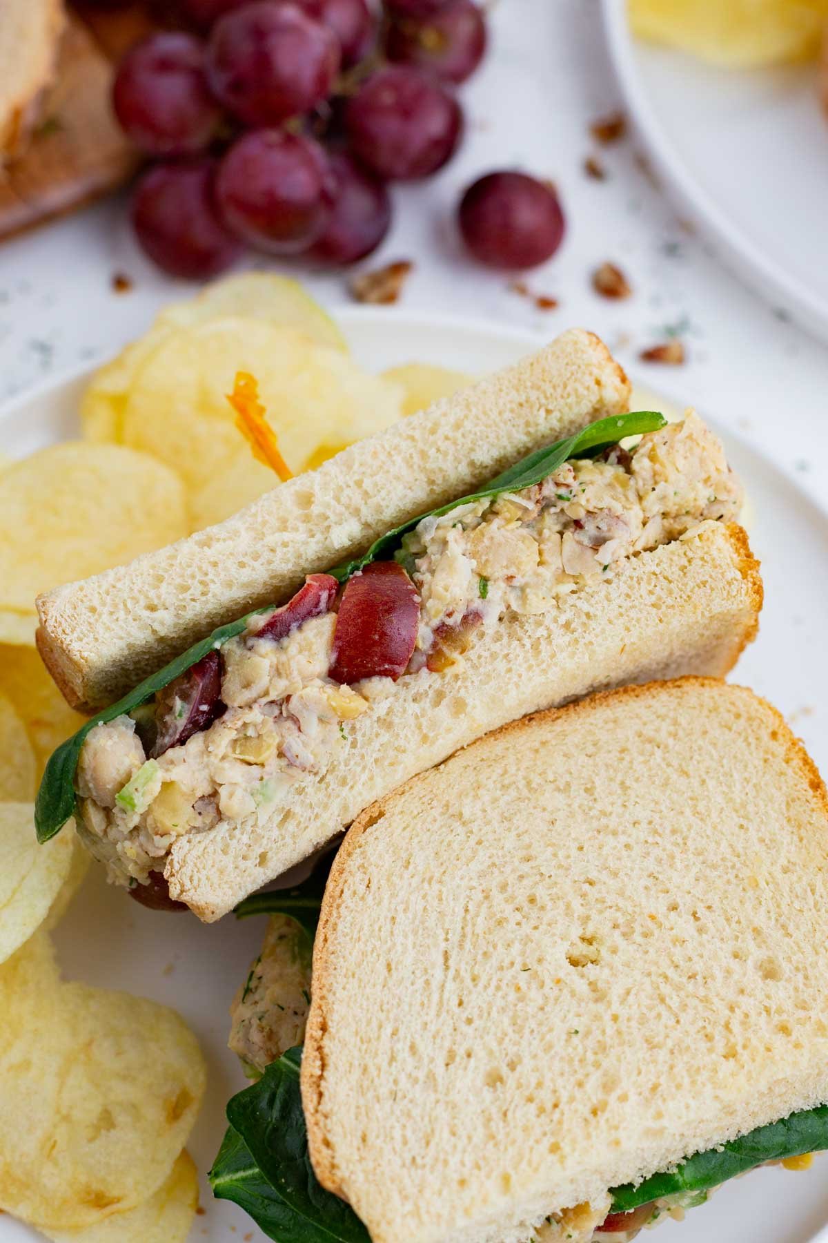 Chickpea salad is spread on fresh bread for a delicious sandwich.