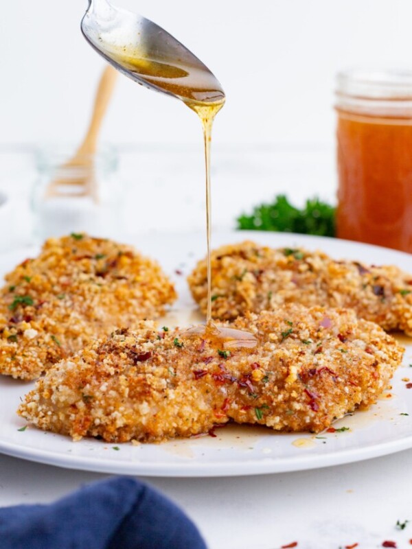 Three chicken breasts are baked in the oven then drizzled with a sweet and spicy hot honey.