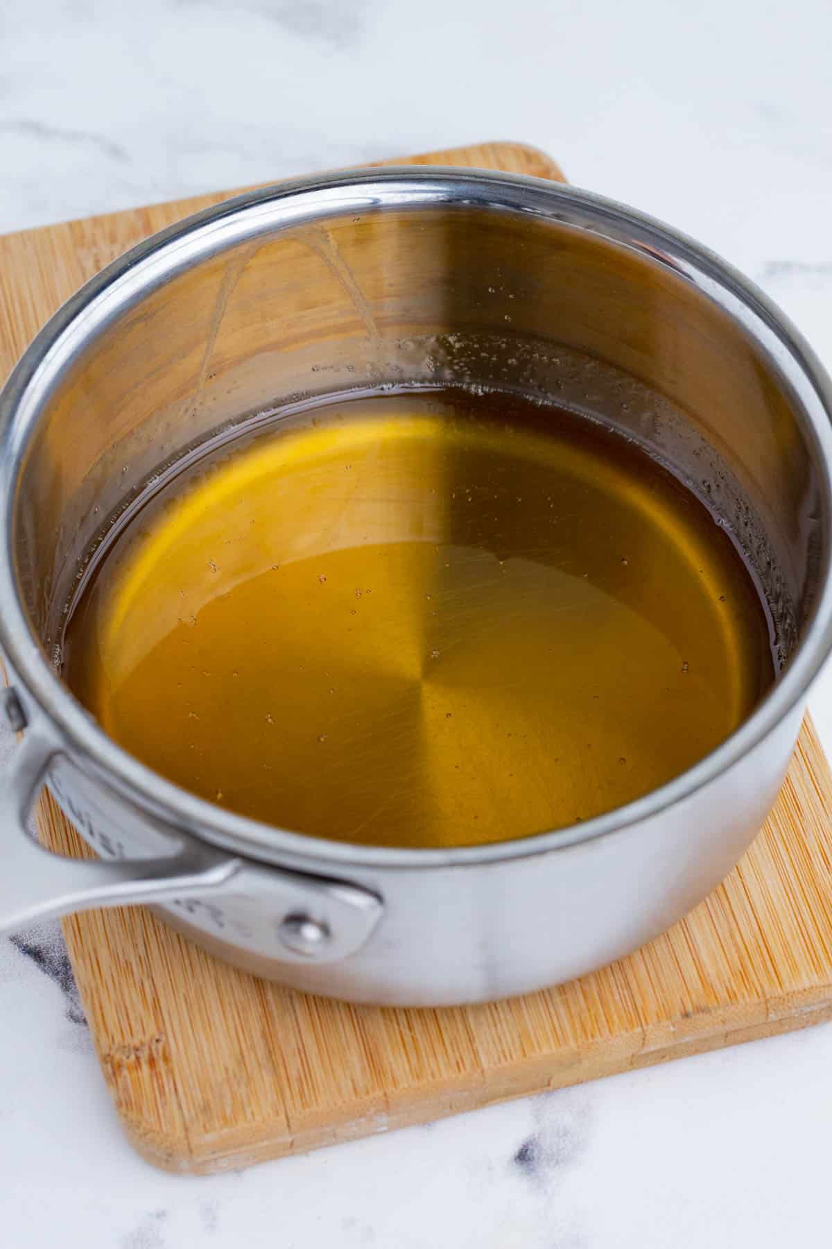Boiled honey is removed from the heat.