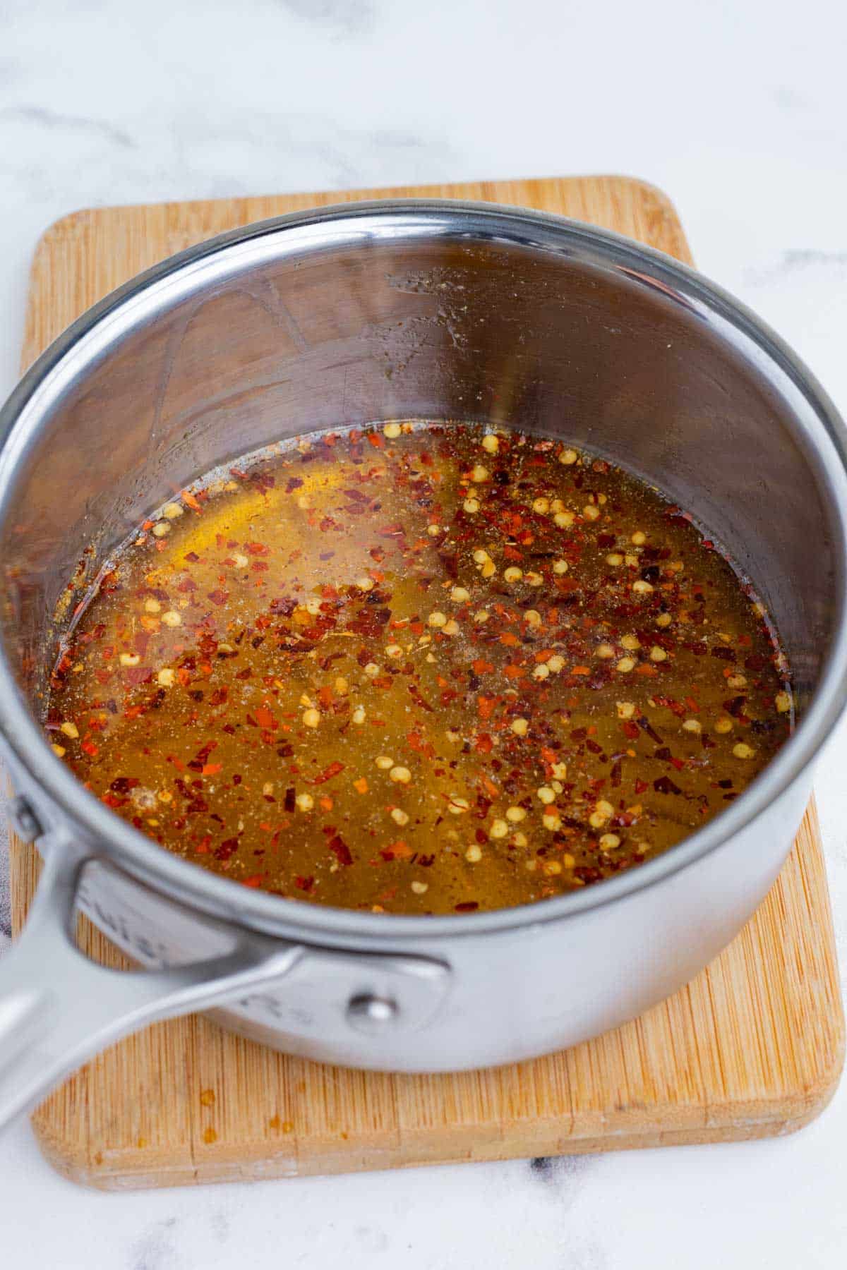 Red pepper flakes and honey marinade together.