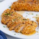 Breaded chicken is baked in the oven, then covered with a homemade hot honey sauce.