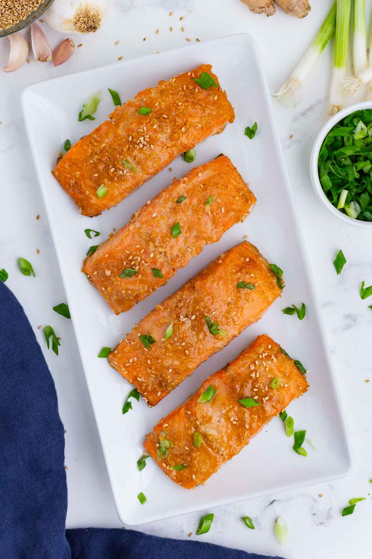 An overhead shot of salmon filets cooked in a miso glaze.