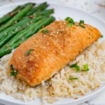 Salmon, green beans, and brown rice is a healthy meal.