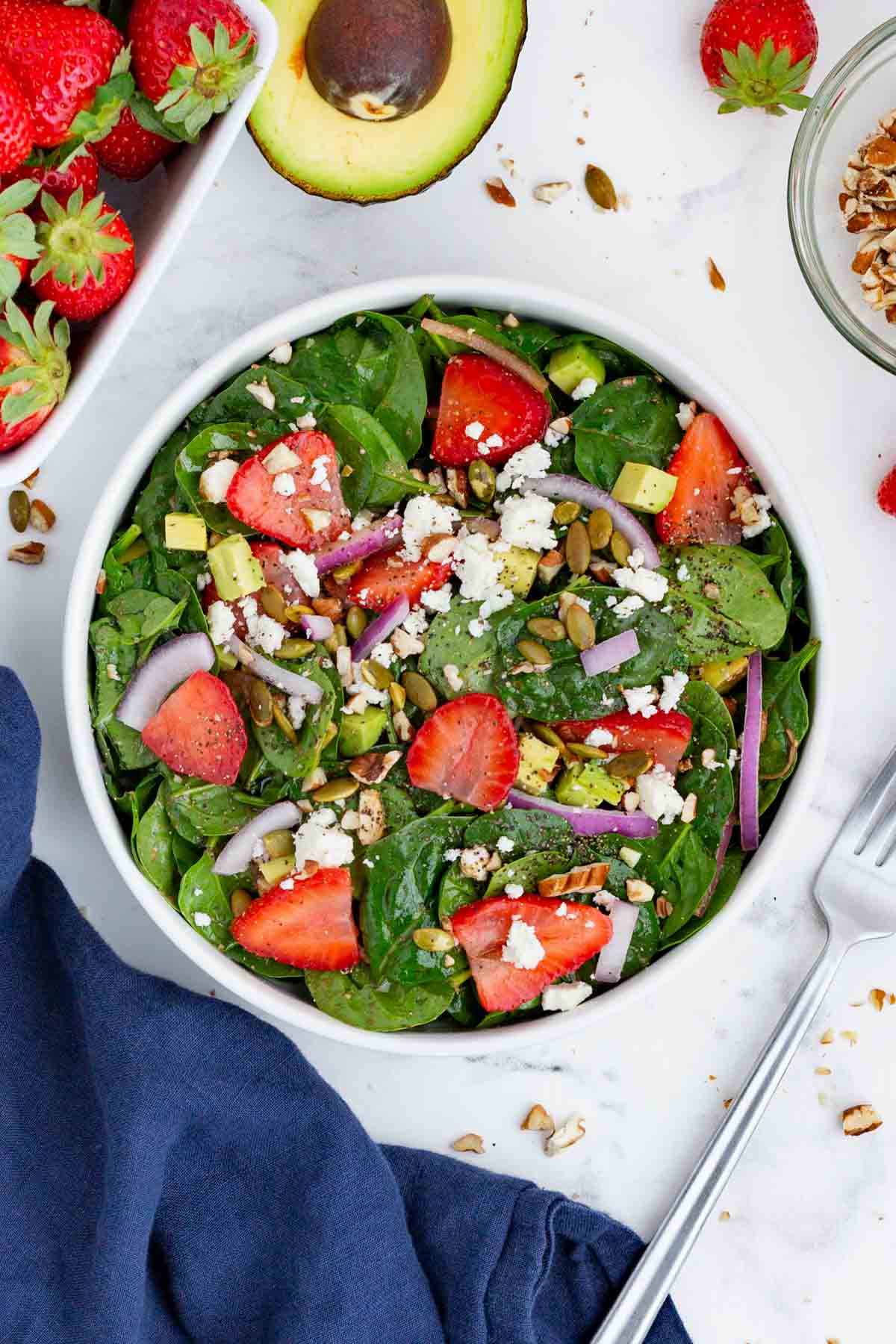 This strawberry spinach salad is the perfect dish for hot, summer months.